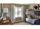 Cozy bedroom with bunk beds, baseball decor, and a window seat at 4237 Ridgewalk Pt, Castle Rock, CO 80108