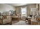 Charming Bedroom with two cribs, a rocking chair, and a nature-themed mural at 4237 Ridgewalk Pt, Castle Rock, CO 80108