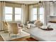 Bright breakfast nook features large windows, comfortable seating, and plenty of natural light at 4237 Ridgewalk Pt, Castle Rock, CO 80108