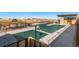 Community pool with covered patio and seating at 4237 Ridgewalk Pt, Castle Rock, CO 80108