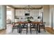 Open concept kitchen with white cabinets, quartz countertops, and an island at 4237 Ridgewalk Pt, Castle Rock, CO 80108