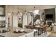 Open concept kitchen features island with seating, stainless steel appliances, and white cabinetry at 4237 Ridgewalk Pt, Castle Rock, CO 80108
