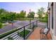 Balcony overlooking a beautiful intersection with lush trees and colorful sunset views at 4590 Wolff St, Denver, CO 80212