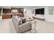 Spacious finished basement featuring a wet bar, lounge area, and modern entertainment center at 4590 Wolff St, Denver, CO 80212