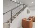 Finished basement stairs leading to a cozy seating area with stylish furniture at 4590 Wolff St, Denver, CO 80212