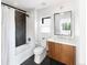 Modern bathroom featuring subway tile, black herringbone accent wall, and sleek vanity at 4590 Wolff St, Denver, CO 80212