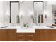 Bright bathroom with double vanity sinks, contemporary mirrors, and ample cabinet space at 4590 Wolff St, Denver, CO 80212