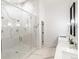 Modern bathroom featuring a frameless glass shower with marble tile, and double sink vanity at 4590 Wolff St, Denver, CO 80212