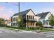 Attractive 2 story house on a corner lot with a black metal roof, a balcony, and professional landscaping at 4590 Wolff St, Denver, CO 80212