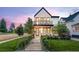 Charming two-story home boasts a modern design, well-manicured lawn, and inviting walkway to the front door at 4590 Wolff St, Denver, CO 80212