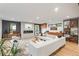 Inviting living room with fireplace, modern furniture, and hardwood flooring, perfect for relaxing or entertaining guests at 4590 Wolff St, Denver, CO 80212