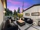 Backyard patio with pavers, a fire pit, grill, and comfortable outdoor seating at 4590 Wolff St, Denver, CO 80212