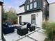 Backyard patio with pavers, a fire pit, modern seating, and native grasses at 4590 Wolff St, Denver, CO 80212