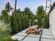 Backyard patio with pavers, string lights, and a wooden picnic table at 4590 Wolff St, Denver, CO 80212