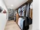 Well-organized walk-in closet showcasing ample hanging space, built-in shelving and hardwood floors at 4590 Wolff St, Denver, CO 80212