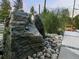 Backyard water feature composed of stones, plants, and custom stonework at 4590 Wolff St, Denver, CO 80212