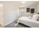 Inviting bedroom featuring soft, neutral tones, plush carpet, and two windows providing natural light at 3082 S Florence Ct, Denver, CO 80231