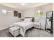 Cozy bedroom with soft lighting, plush bedding, and serene decor, creating a relaxing and inviting space at 3082 S Florence Ct, Denver, CO 80231
