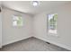 Bright bedroom featuring gray carpet, neutral walls and two windows offering natural light at 3082 S Florence Ct, Denver, CO 80231