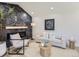 Elegant living room featuring a modern fireplace, a chic chair, and a cozy sofa, perfect for relaxing at 3082 S Florence Ct, Denver, CO 80231