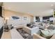 Open living area with a view into the kitchen at 17937 Herrera Dr, Parker, CO 80134