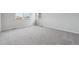Spacious bedroom with plush carpet and natural light from windows at 1341 Loraine N Cir, Lafayette, CO 80026