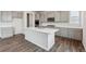 Modern kitchen featuring gray cabinets, white countertops, a large island, and stainless steel appliances at 1341 Loraine N Cir, Lafayette, CO 80026
