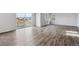 Open living room with sliding glass doors to the balcony and wood-look flooring at 1341 Loraine N Cir, Lafayette, CO 80026