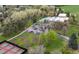 Aerial view showing park including tennis courts, pool and mature trees in neighborhood at 2571 S Birch St, Denver, CO 80222