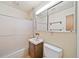 Functional bathroom featuring a shower over tub, vanity, and mirrored medicine cabinet at 2571 S Birch St, Denver, CO 80222