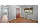 Cozy bedroom with wood floors, closet, and a large window offering natural light at 2571 S Birch St, Denver, CO 80222