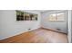 A bedroom with two windows and hardwood floors at 2571 S Birch St, Denver, CO 80222