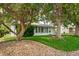 Charming single-story home with a well-maintained lawn and mature trees at 2571 S Birch St, Denver, CO 80222