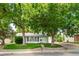 Inviting home exterior with a well-manicured lawn and mature trees at 2571 S Birch St, Denver, CO 80222