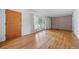 Spacious living room boasts natural light, hardwood floors and a classic brick accent wall at 2571 S Birch St, Denver, CO 80222