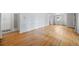 Open living area with hardwood floors and white walls offering a clean and minimalist aesthetic at 2571 S Birch St, Denver, CO 80222