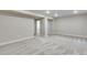 Spacious finished basement with neutral walls and carpet, plus an adjacent bathroom at 1443 Great Western Dr, Longmont, CO 80501