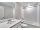 This simple bathroom has a large vanity and shower-tub combination with white tile at 1443 Great Western Dr, Longmont, CO 80501