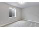 This bedroom is naturally lit, with a bright white color palette and plush gray carpet at 1443 Great Western Dr, Longmont, CO 80501