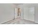 Cozy bedroom featuring neutral carpet, a closet, and a door to the staircase at 1443 Great Western Dr, Longmont, CO 80501