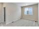 Comfortable bedroom with neutral carpet, large window with blinds, and ample natural light at 1443 Great Western Dr, Longmont, CO 80501