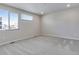 Bright bedroom featuring two windows and neutral carpet, offering a serene and comfortable space at 1443 Great Western Dr, Longmont, CO 80501