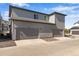 Attached garages offer convenient parking and storage, complementing the modern townhome's design at 1443 Great Western Dr, Longmont, CO 80501