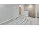 Second-floor hallway with plush patterned carpet, a laundry room, and natural light at 1443 Great Western Dr, Longmont, CO 80501