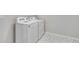 Bright laundry room features side-by-side washer and dryer with tile flooring at 1443 Great Western Dr, Longmont, CO 80501