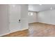 Bright, modern living room with hardwood floors, recessed lighting, and a view of the front door at 1443 Great Western Dr, Longmont, CO 80501