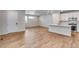 Bright living room featuring wood floors and a modern open floor plan with ample natural light at 1443 Great Western Dr, Longmont, CO 80501
