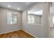 Bright living area features wood floors, natural light, and a view to adjacent space at 1443 Great Western Dr, Longmont, CO 80501