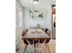 Bright dining room with modern furnishings, ample seating, and decor shelving at 4080 Adams St, Denver, CO 80216