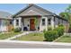 Lovely home with a tidy front yard, covered entry, and neutral-colored siding at 4080 Adams St, Denver, CO 80216